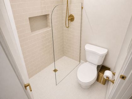After: redesigned walk-in shower with custom tile and gold fixtures - an on-the-spot design mockup