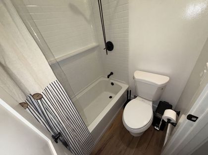 Before: the original tub-and-shower bathroom