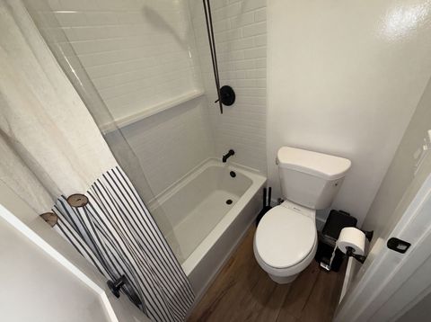 Before: the original tub-and-shower bathroom